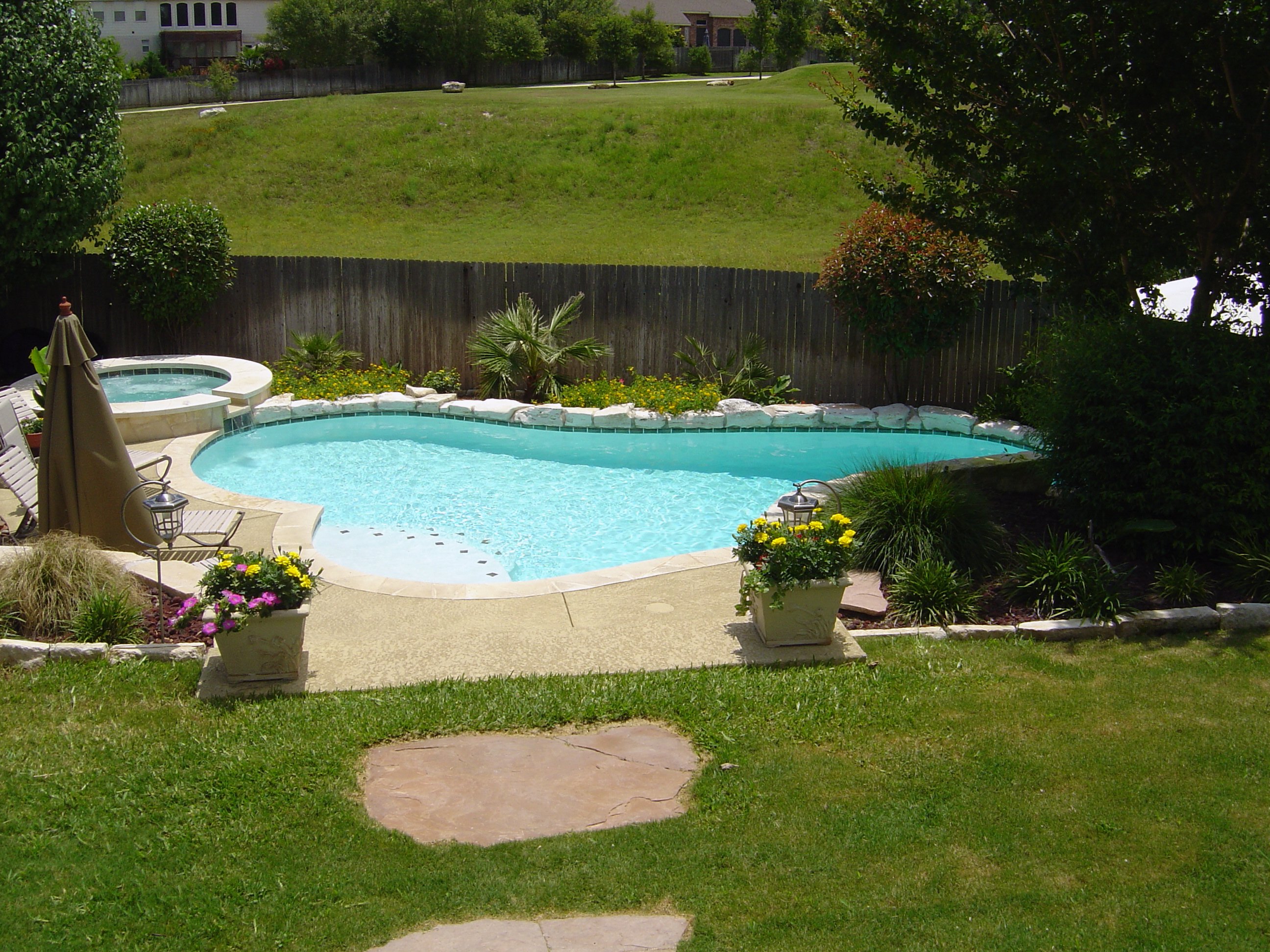Pool and Spa with Sun Shelf and Fieldstone Border